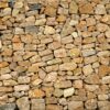 Golden masonry stone wall from old building Eski Taş Duvar Posteri